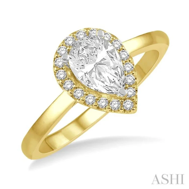 1/3 ctw Round Cut Diamond Halo Engagement Ring With 1/4 ctw Pear Cut Center Stone in 14K Yellow and White Gold